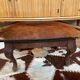Vintage wooden and goatskin pouf