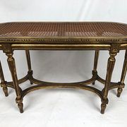 Banquette de piano de style Louis XVI bois doré foncé de canne