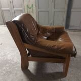 Armchairs in leather and vintage wood 70's