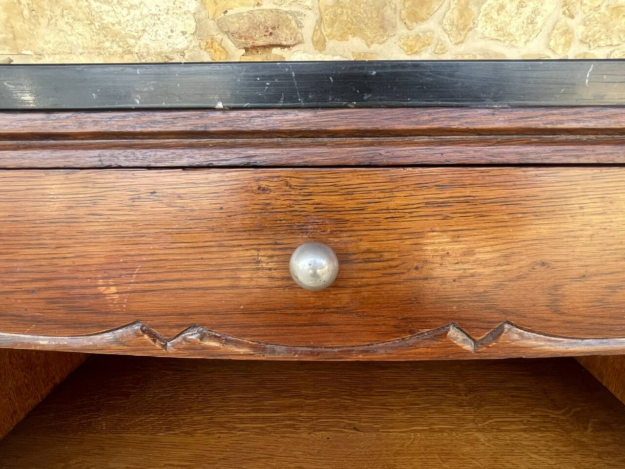 Art Deco bedside table in walnut, black marble top, circa 1920.