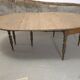 Half-moon extendable oak table for 2 to 8 people.