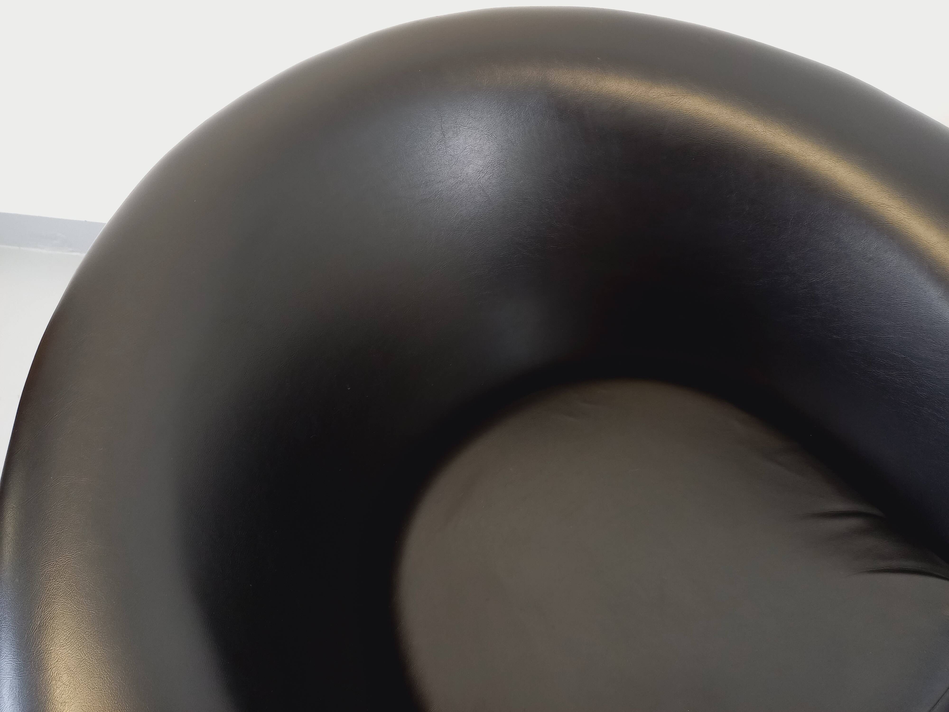 Pair of vintage Scandinavian swivel armchairs in faux leather and chrome.