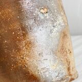 Old rustic stoneware bottle with handle