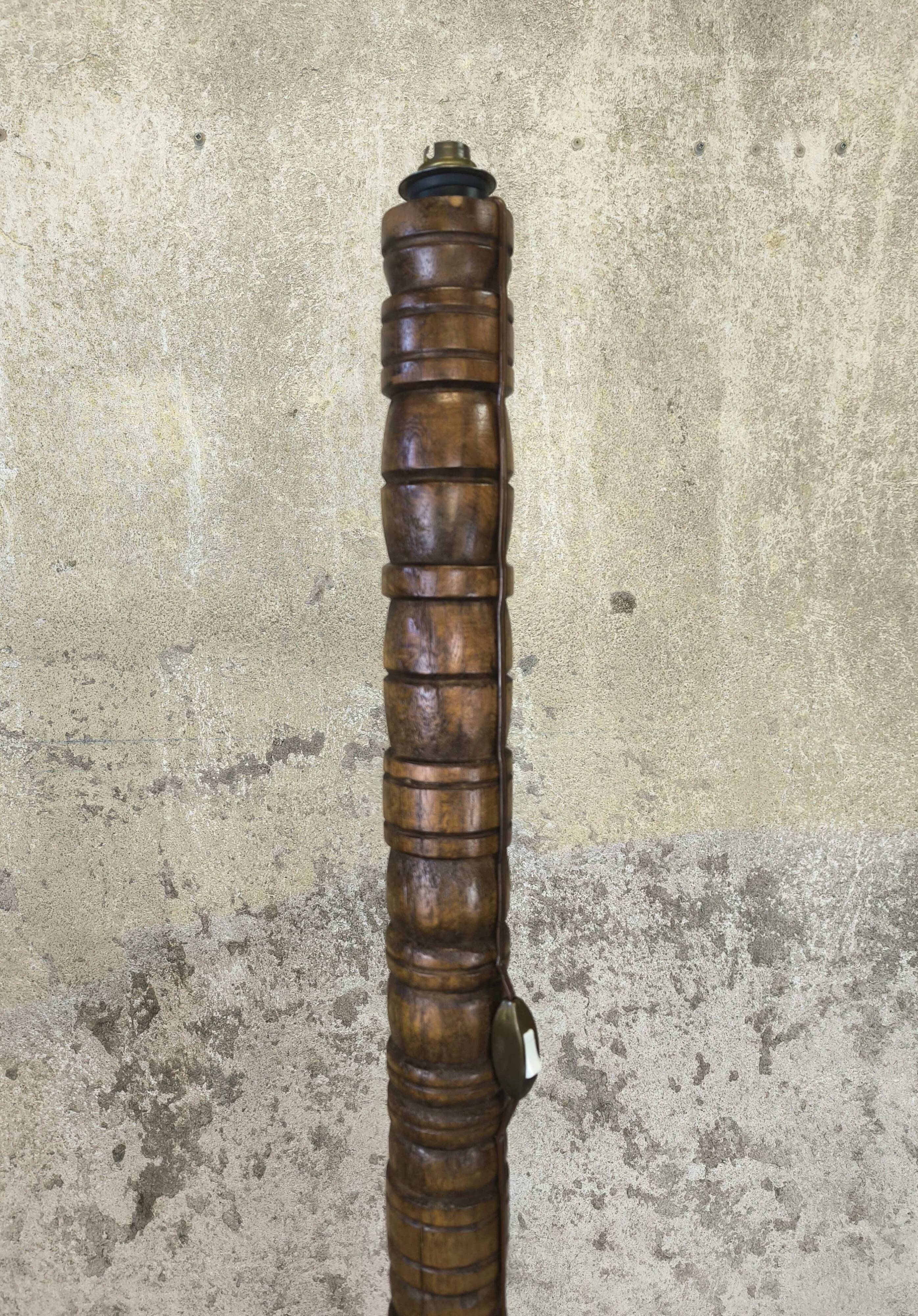 Vintage brutalist floor lamp made of turned wood.