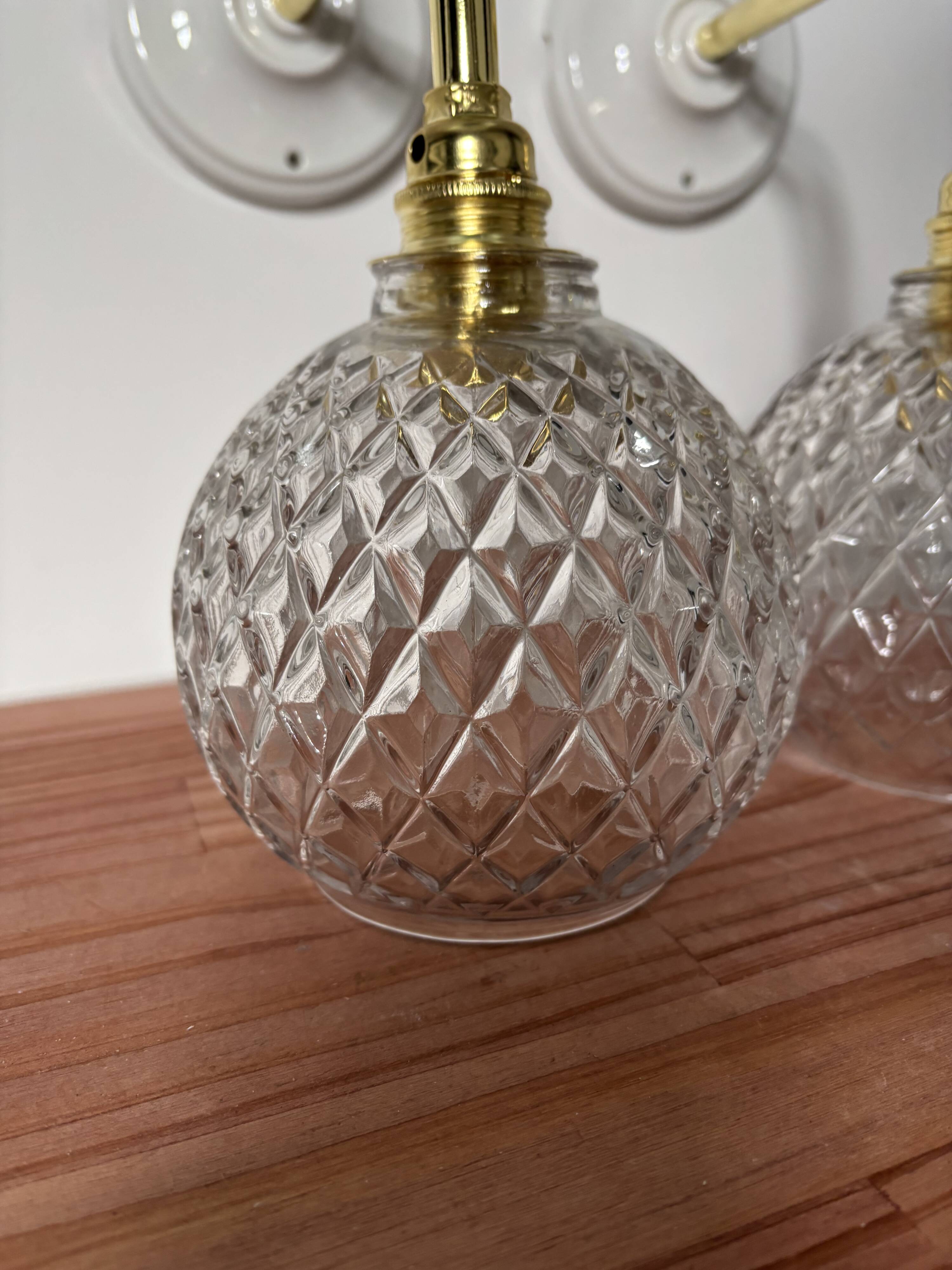 Pair of chiseled glass globe wall sconces