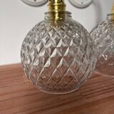 Pair of chiseled glass globe wall sconces