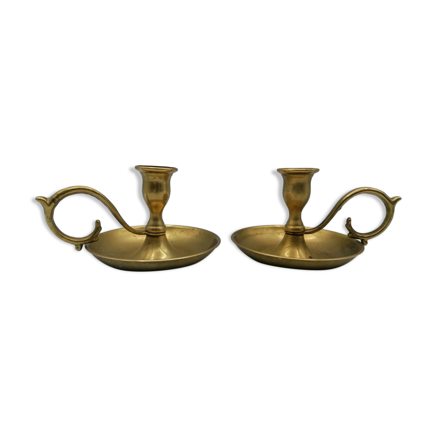 Pair of brass hand candlesticks