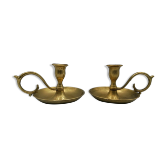 Pair of brass hand candlesticks