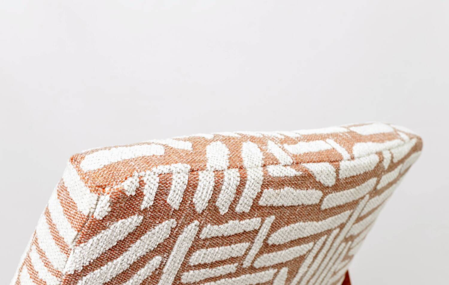 Mid-century modern armchair in coral red jacquard by E. Homa