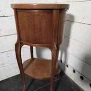 Oval bedside table in Louis XV style made of mahogany.