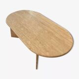 Oval coffee table in raw travertine
