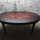 Oval Louis XVI style table with half-moon extensions.