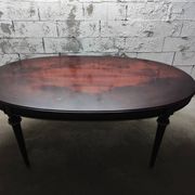 Oval Louis XVI style table with semi-circular extensions.