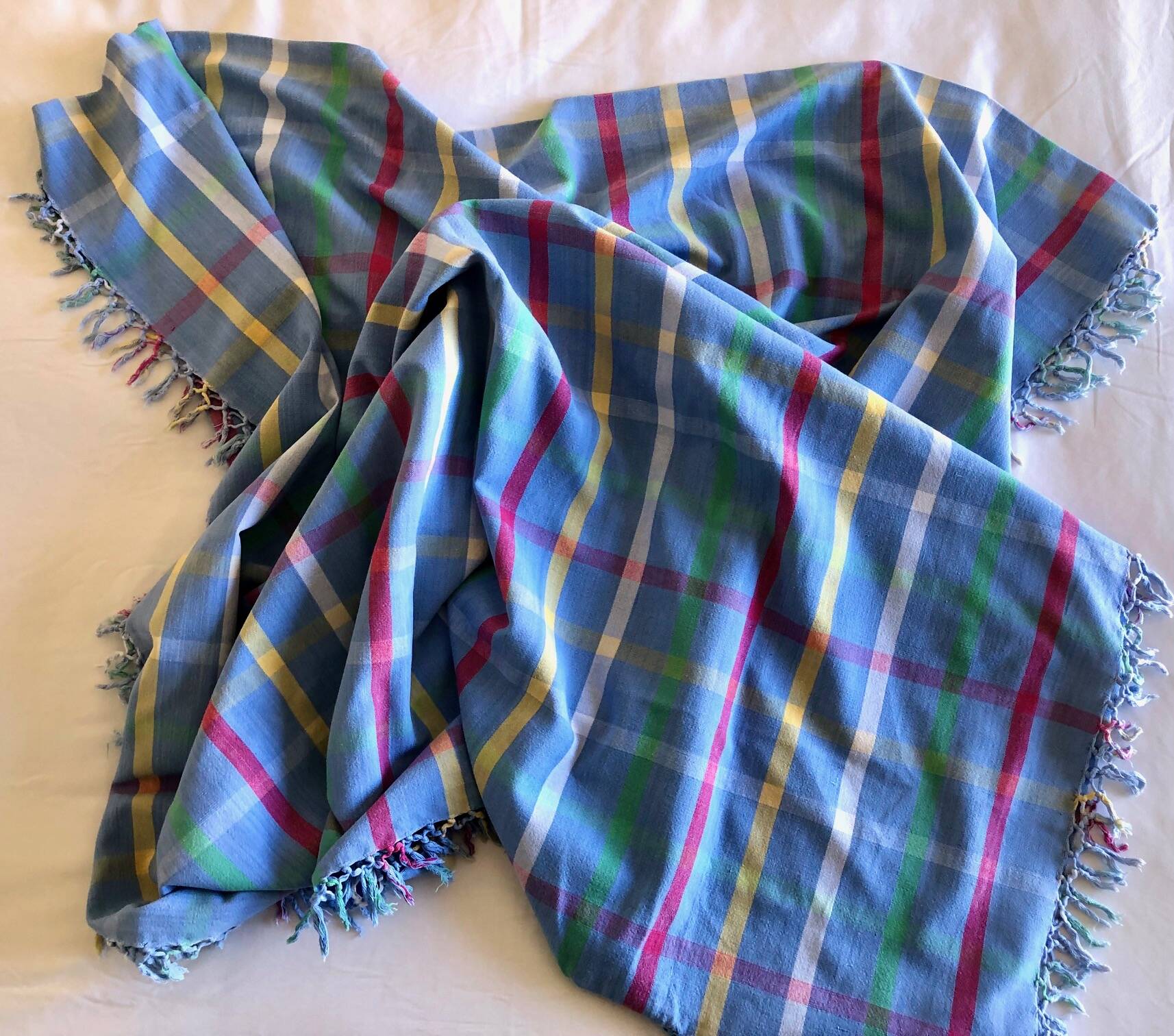 Vintage tablecloth & napkins, blue with multicoloured stripes.