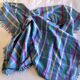 Vintage tablecloth & napkins, blue with multicoloured stripes.