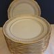 Suite of 14 flat plates golden white porcelain