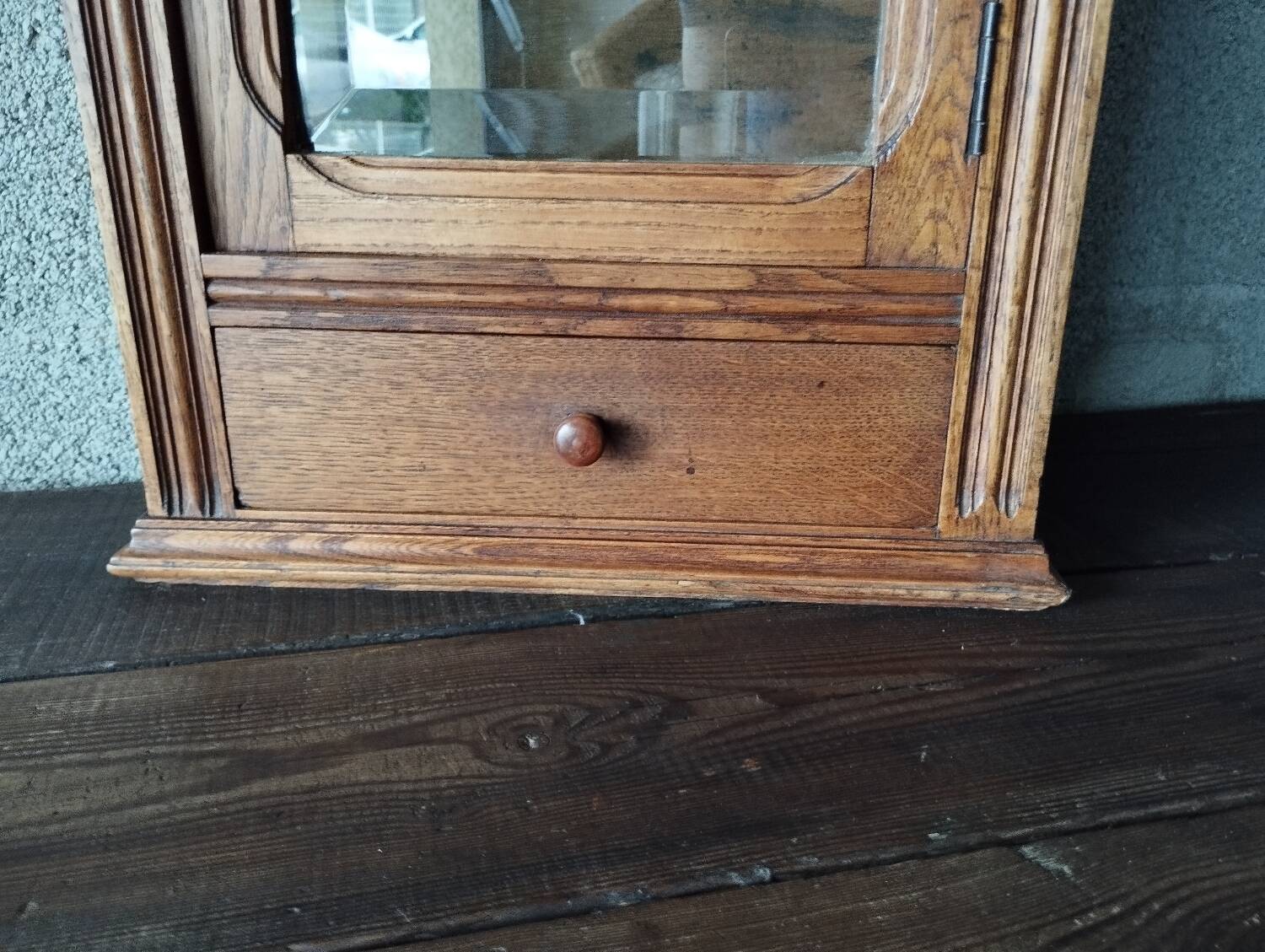 Old glass wall shelf with drawer door
