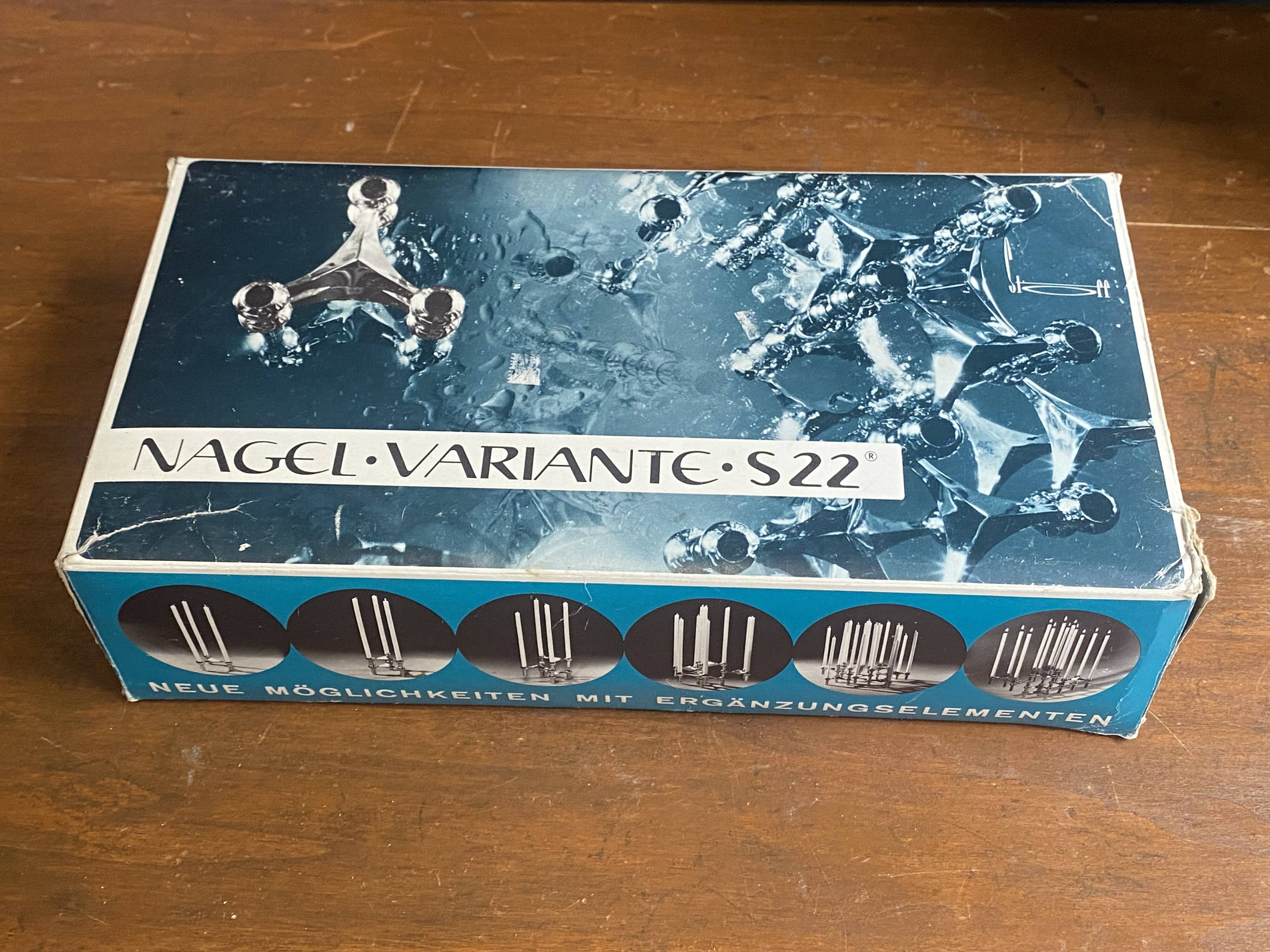 Set of 3 S22 candle holders and 9 vintage 1970 NAGEL modular candles in box.