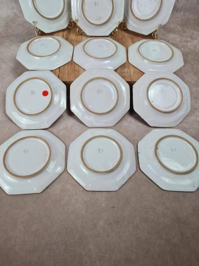Set of 12 small antique plates by Alfred Renoleau, different designs.