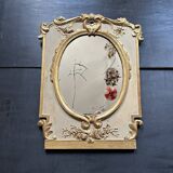 Napoleon III mirror in carved gilded wood, oval mercury glass.