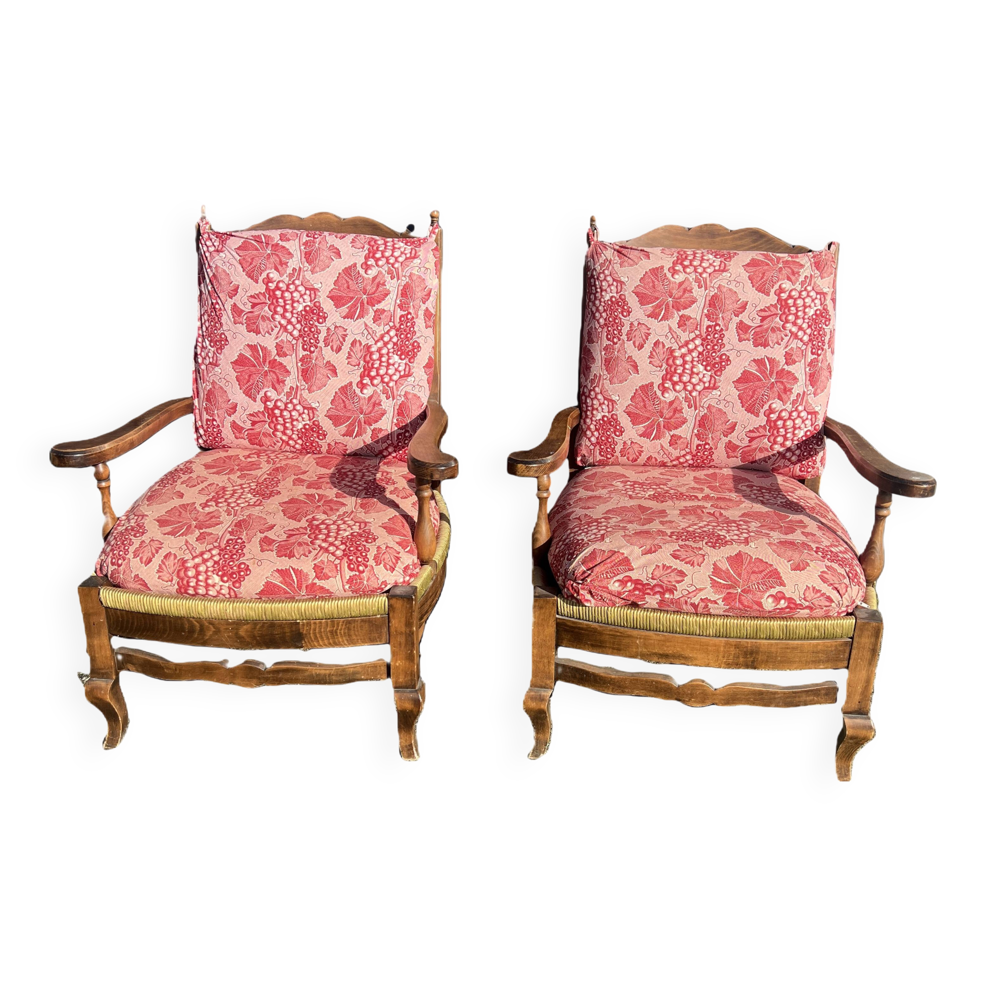 pair of rustic wood and fabric armchairs