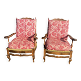 pair of rustic wood and fabric armchairs