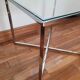 Table basse vintage en verre et pieds chromés – style 70's
