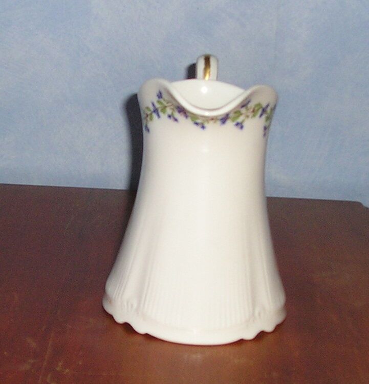 Pitcher in Limoges porcelain, barbel decoration