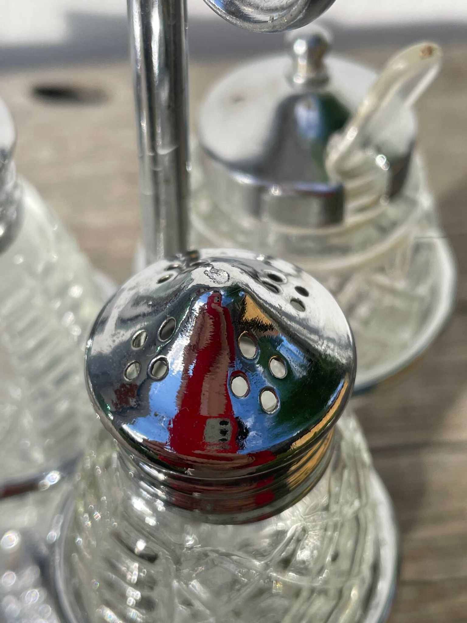 Silver-plated metal and glass salt and pepper shakers