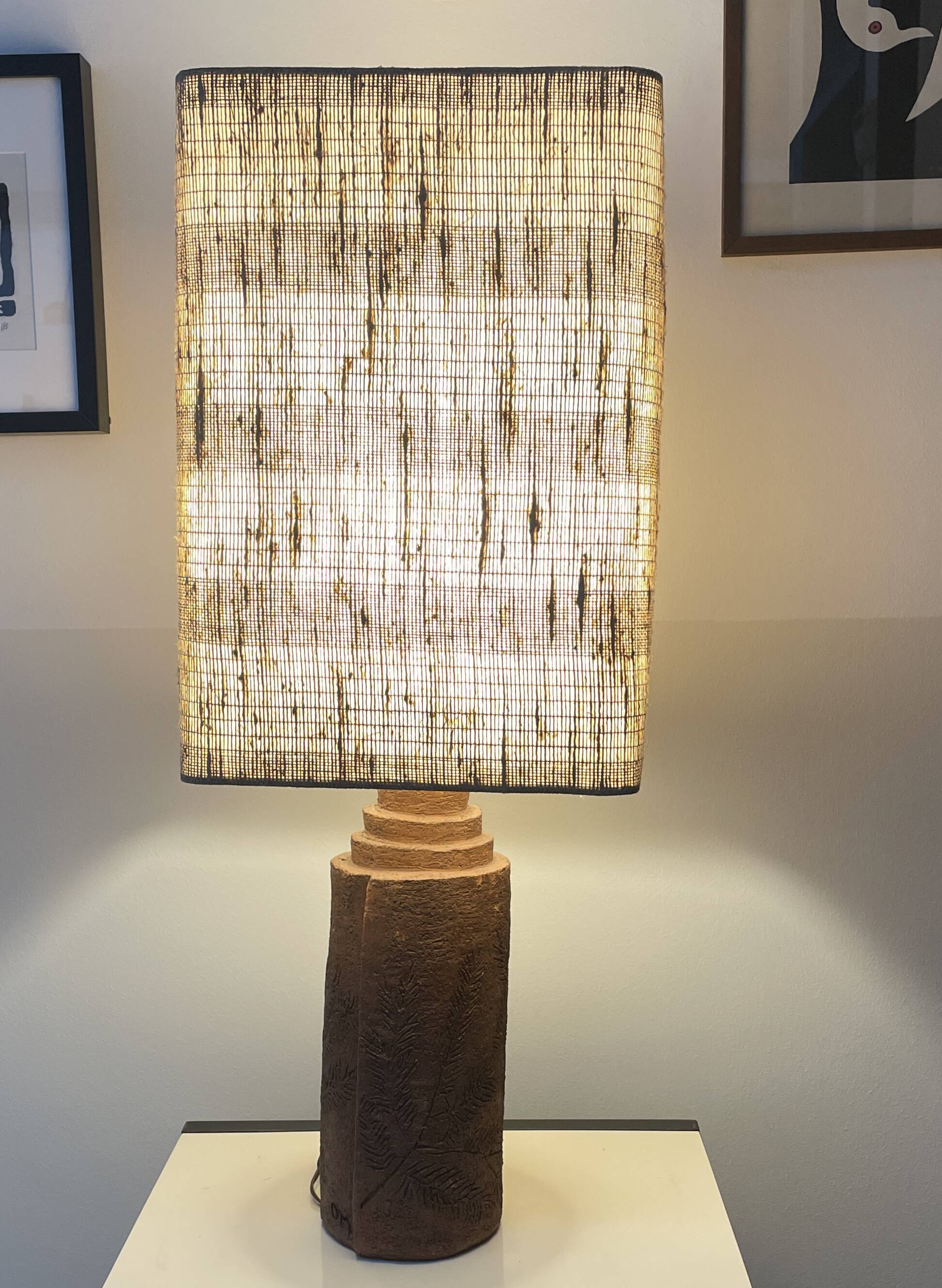 Large chamotte clay lamp in brutalist style, with a plant motif.