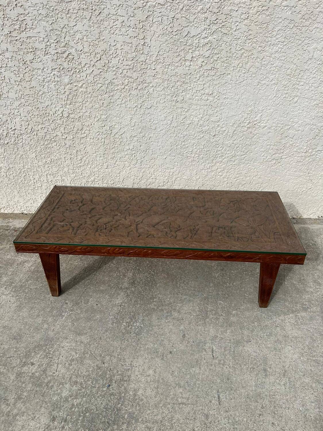 Afro style carved wooden table with glass top