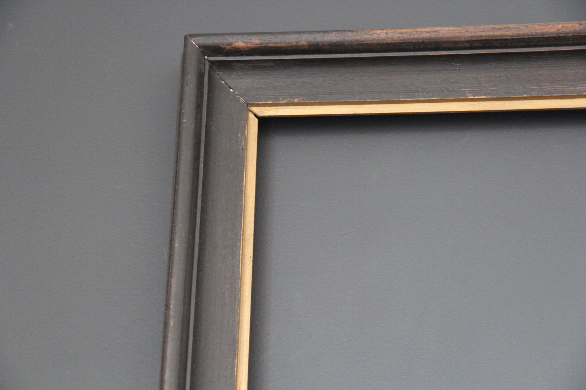 Large wooden black and gilded frame