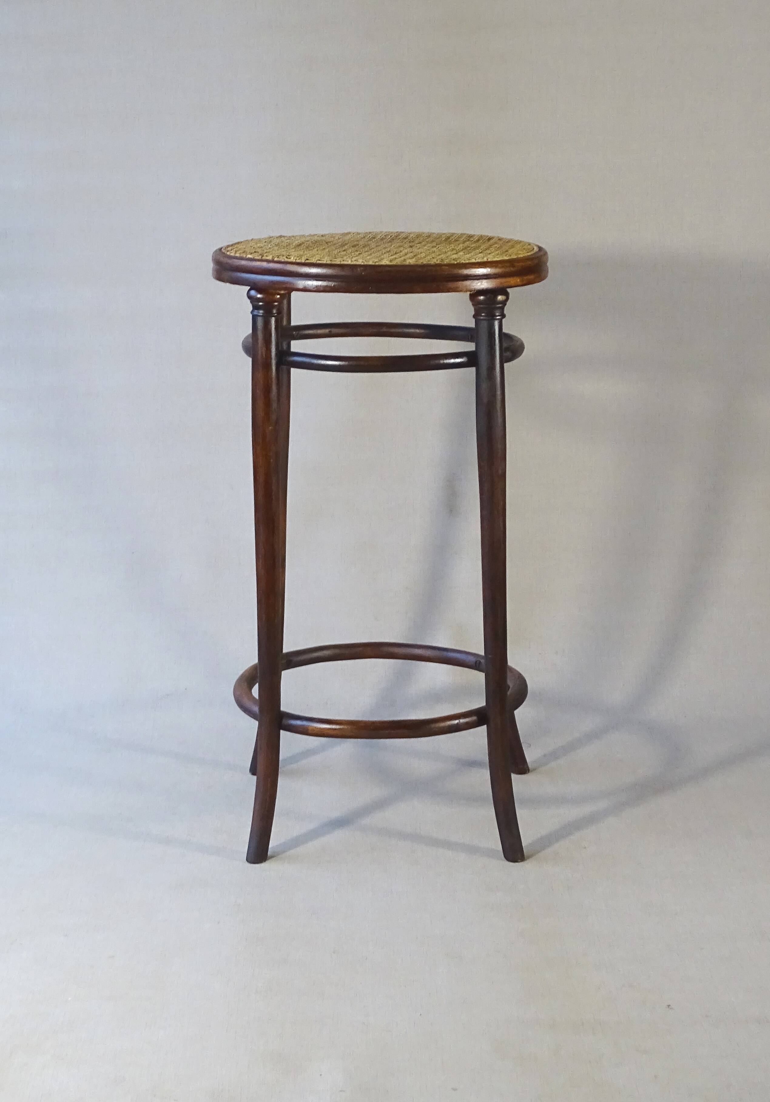 Stool: Bentwood, by Fischel around 1900, caned.