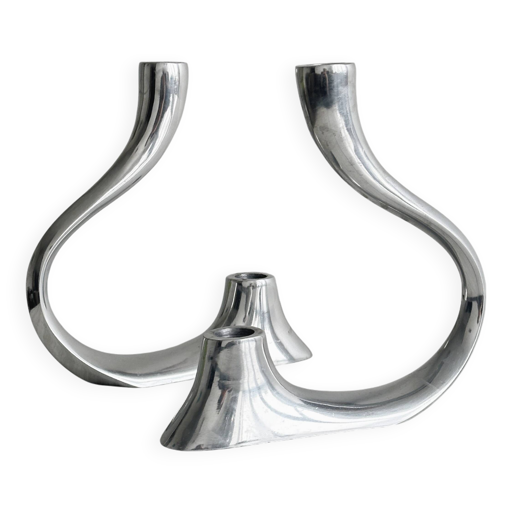 Pair of designer candlesticks in chromed metal