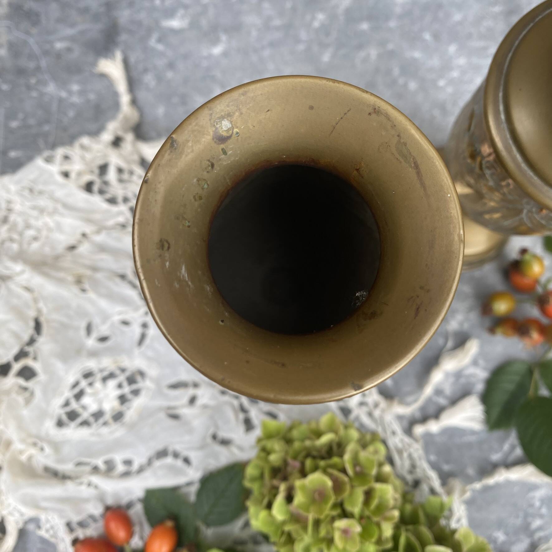 Pair of embossed brass bud vases stamped 17 cm
