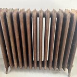 Ancien radiateur sur pied a quatorze lames fleuries en fonte de fer XX sièc