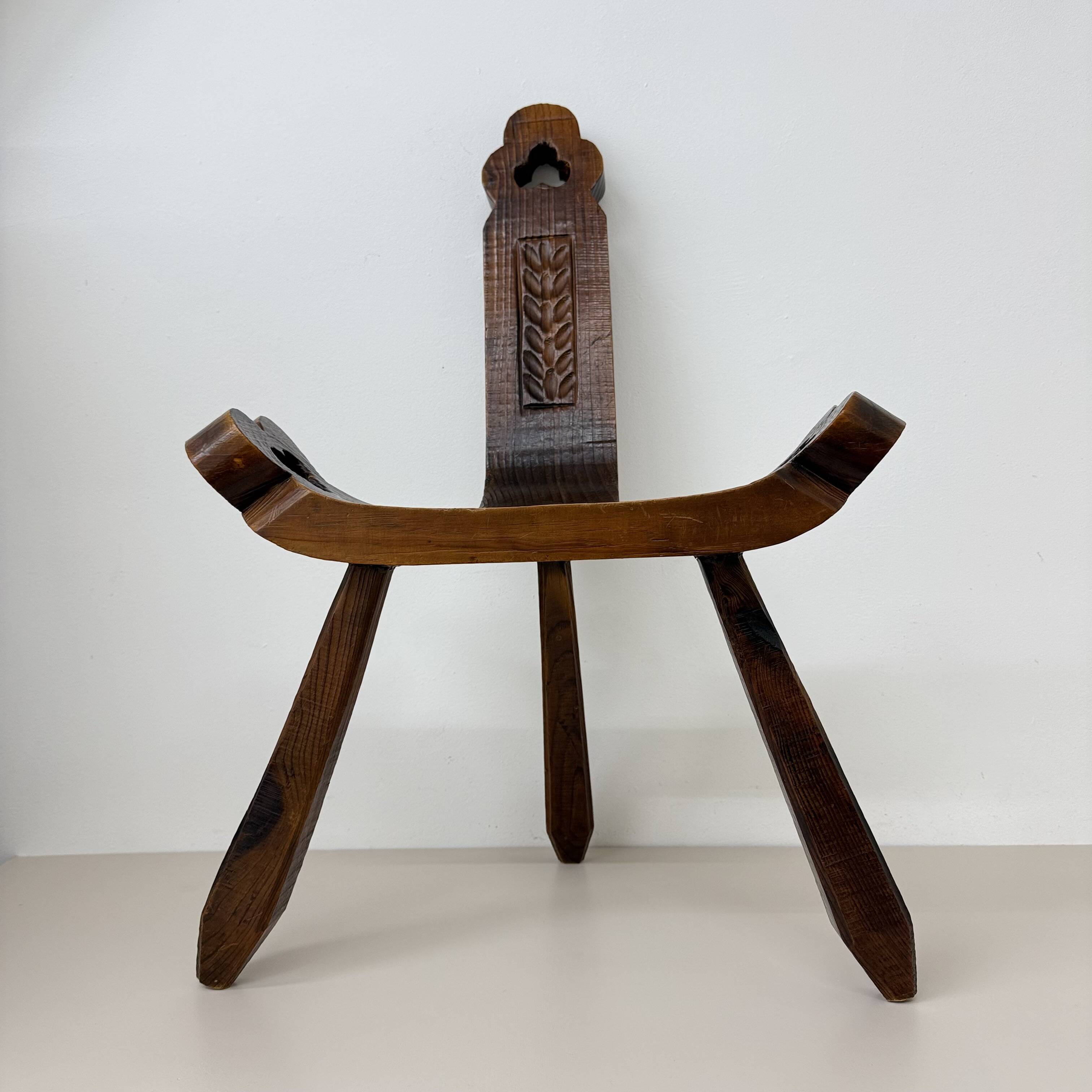 Brutalist hand carved oak Spanish tripod chair , 1970s
