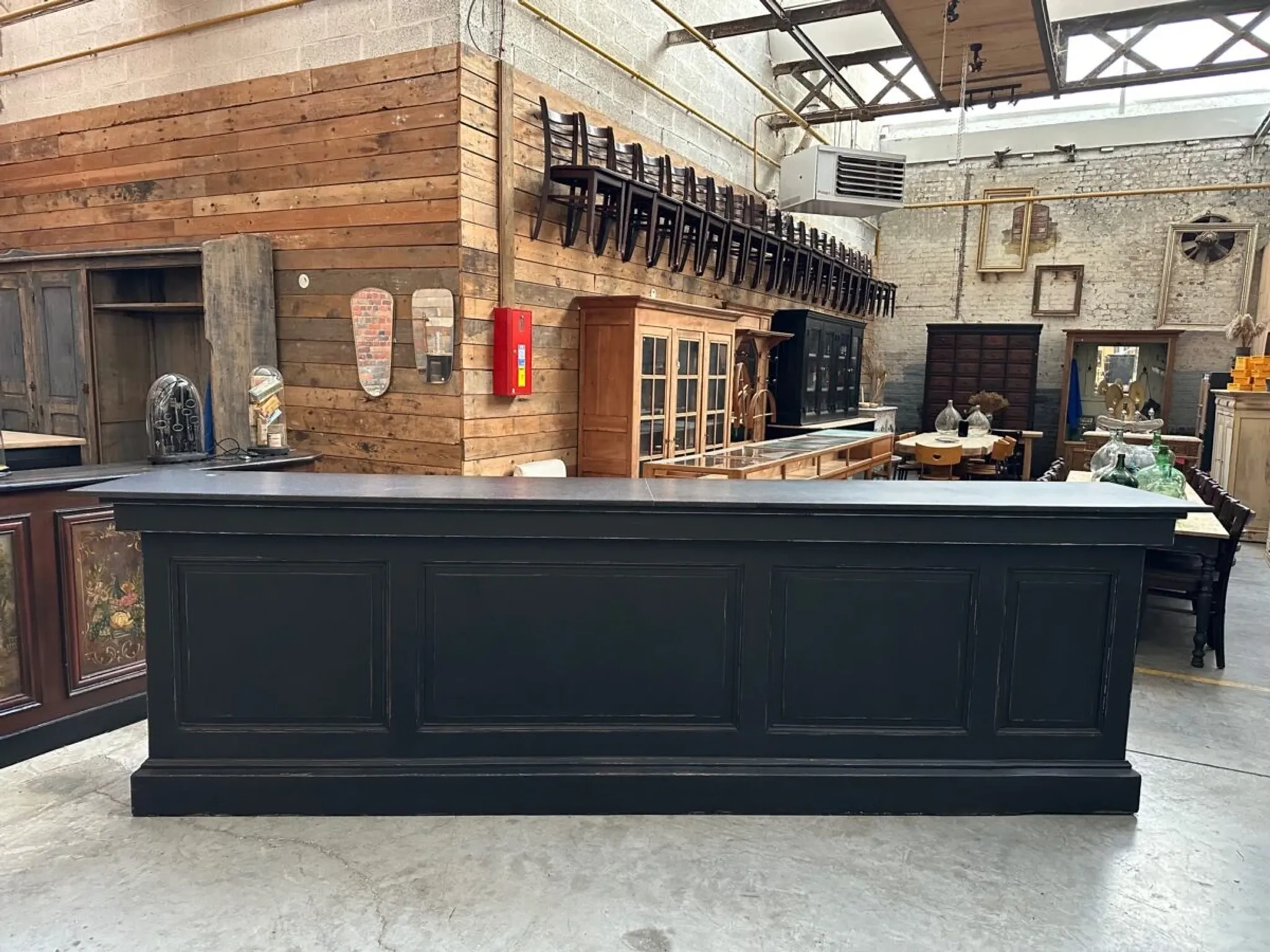 Immense bar counter covered with blue stone.