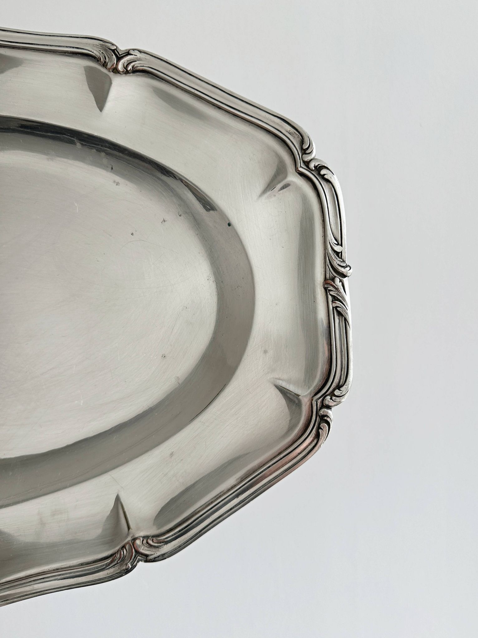 oval silver metal plate