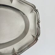 oval silver metal plate