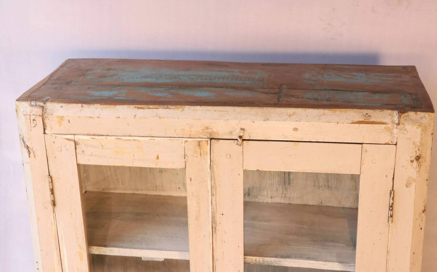Antique display cabinet in bleached cream teak from Burma.