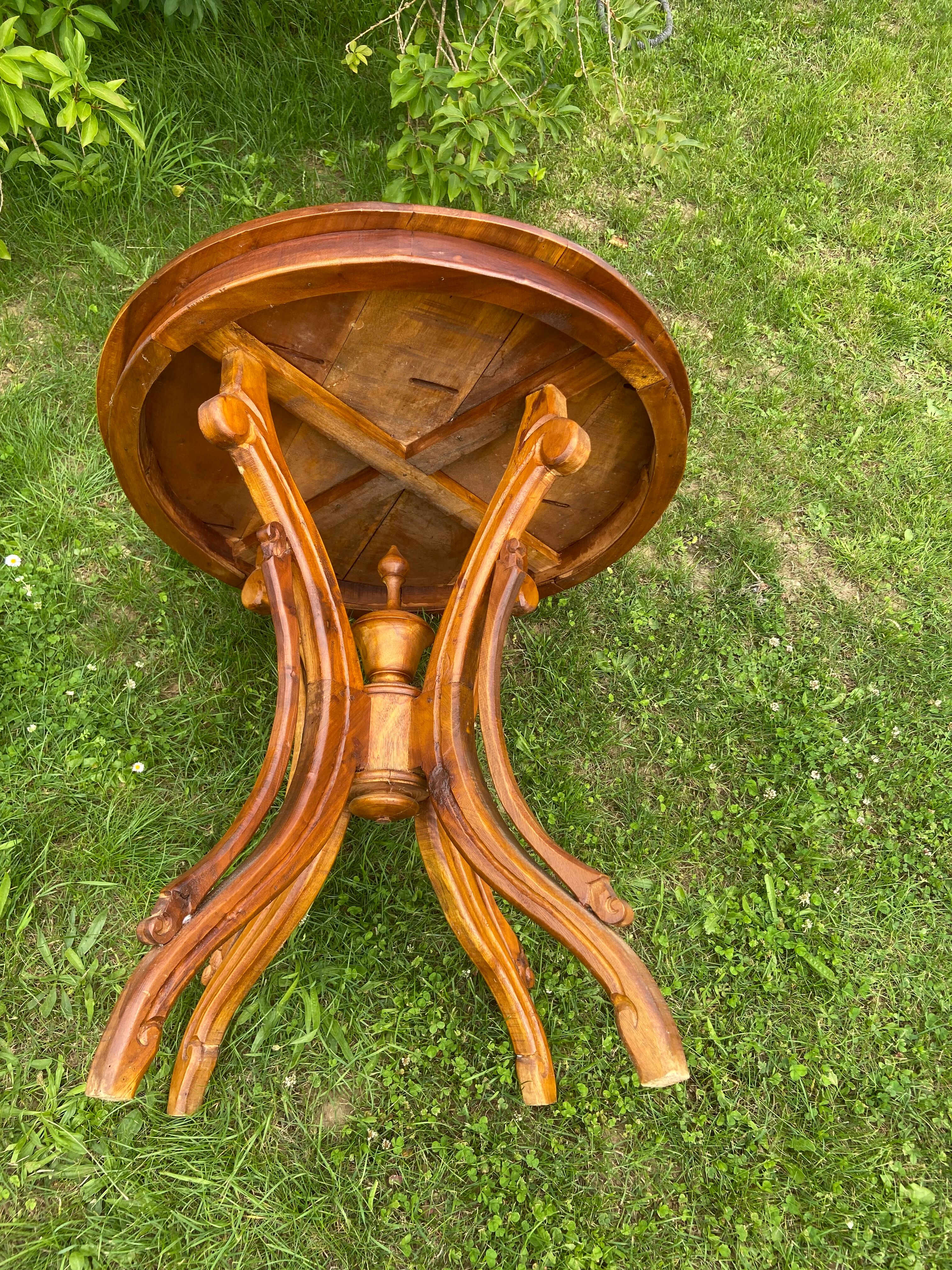 Round table and wrought iron chair