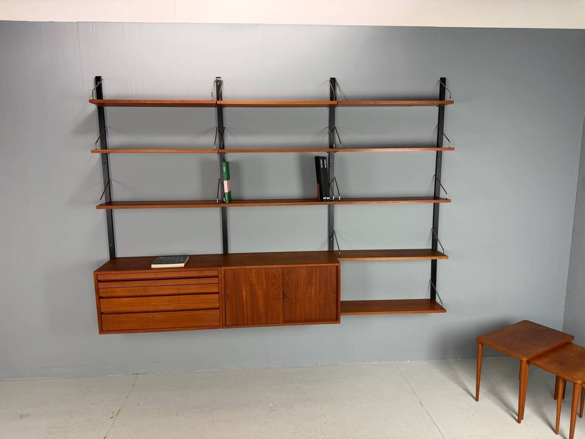 Modular wall shelf in teak in mid-century modern style, designed by Poul Cadovius for Cado, 1960.
