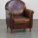 Fauteuil design en cuir de mouton aux finitions soignées et soignées