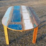 Oval table in polychrome wood