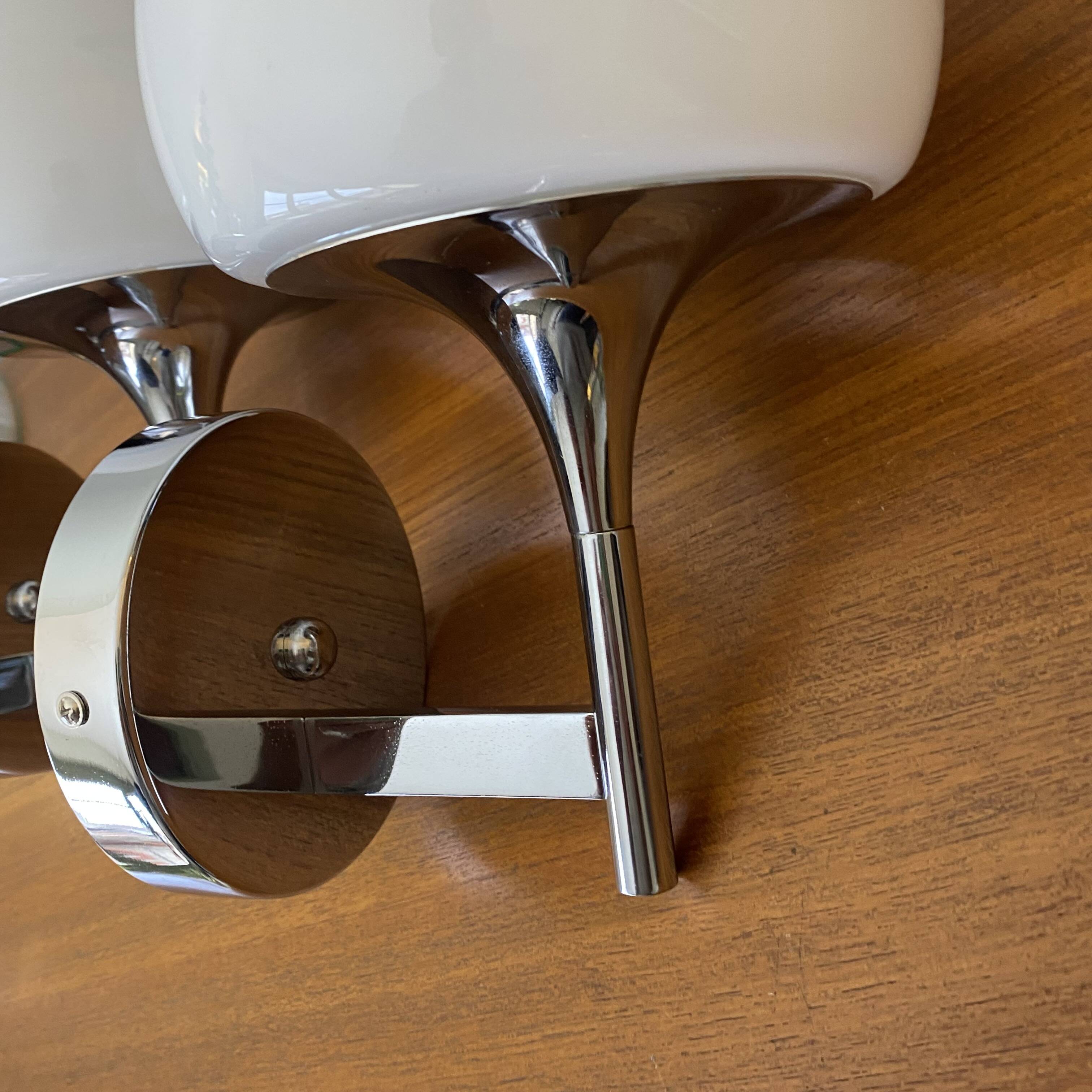 Pair of seventies wall sconces with chrome metal and opaline glass globe.