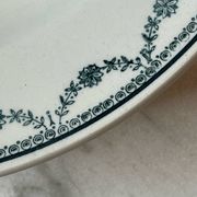Set of 12 deep plates Saint Amand with floral garland decoration.