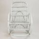 Vintage rocking chair for children in rattan/bamboo.
