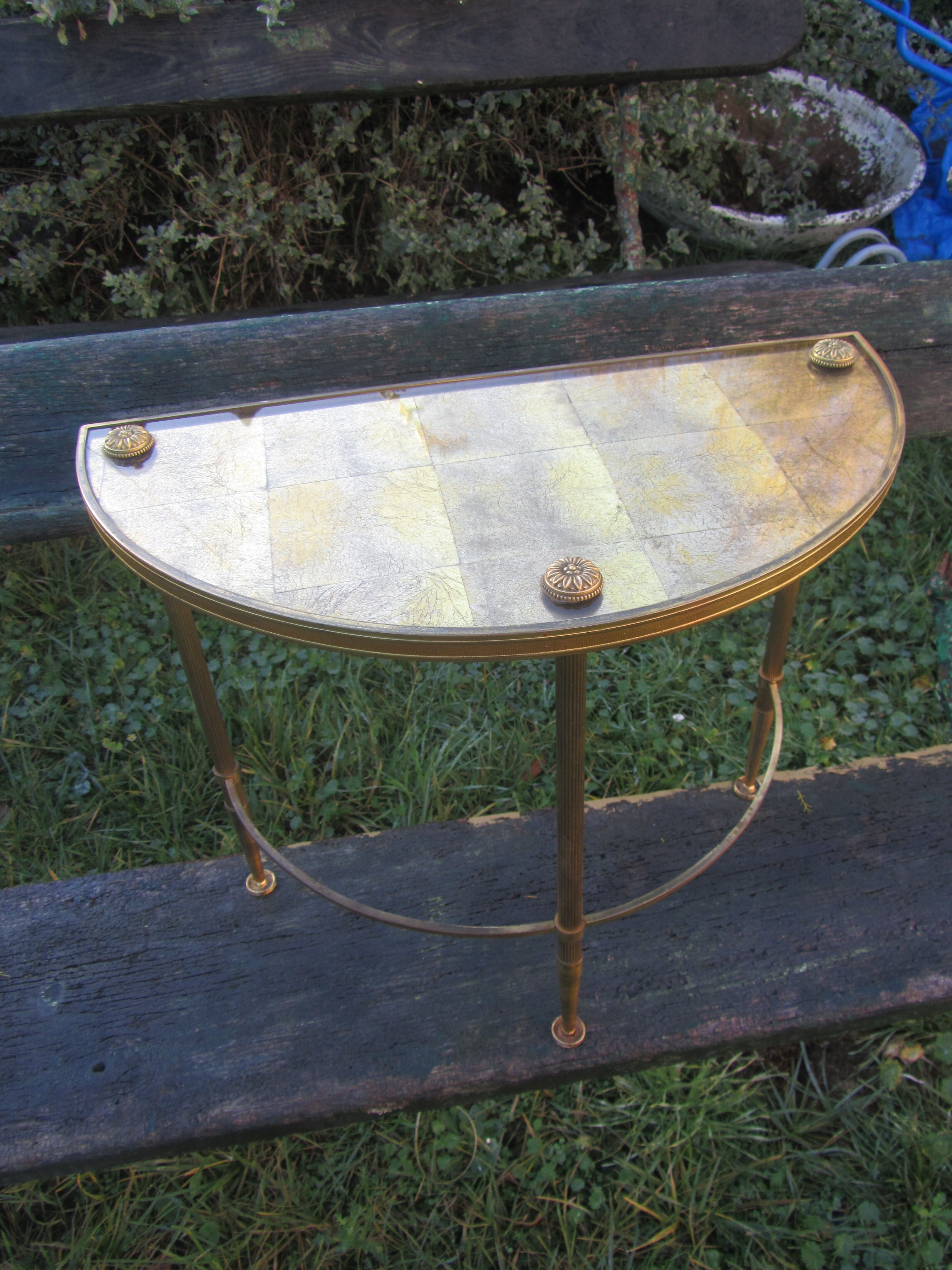 Pair of sofa tips, gilded bronze and 50s glass