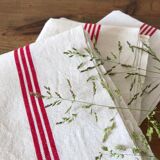 old mixed-race cotton tea towels with red bedding